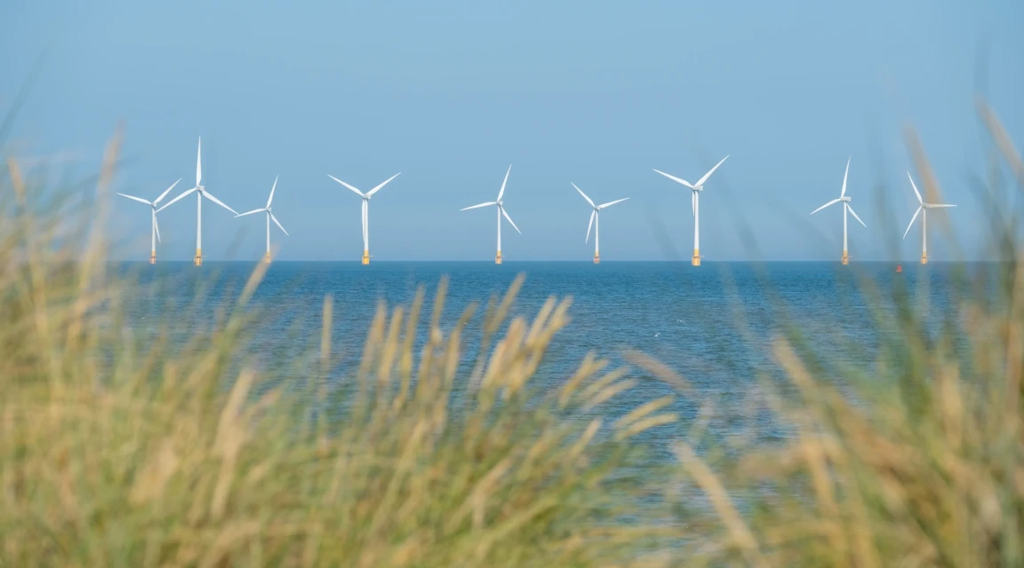 Scroby Sands Wind Farm located in the North Sea off Norfolk coast in the distance