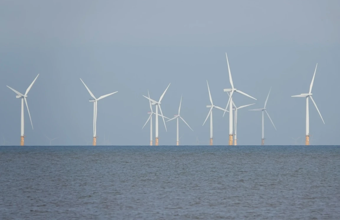 Wind turbines on the horizon off the Norfolk coast UK