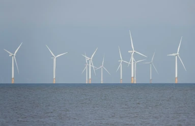 Wind turbines on the horizon off the Norfolk coast UK